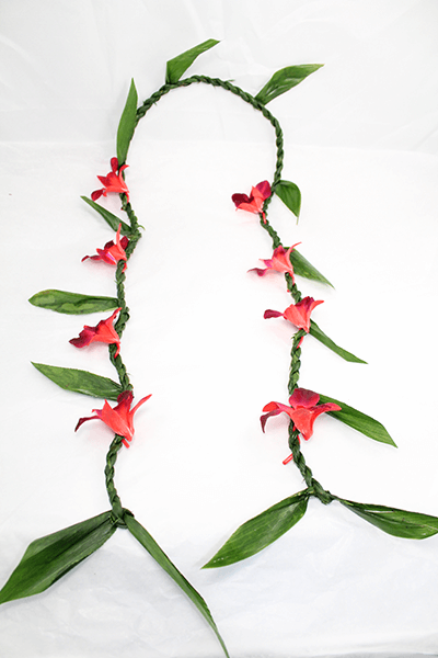Ti Leaf lei is twisted with red orchids